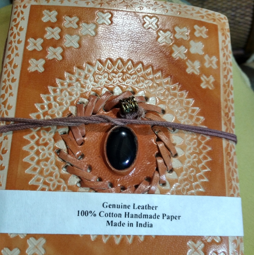 HAND STITCHED, AND EMBOSSED, HARD BACK  LEATHER BOOK/BLACK ONYX CABOCHON.
